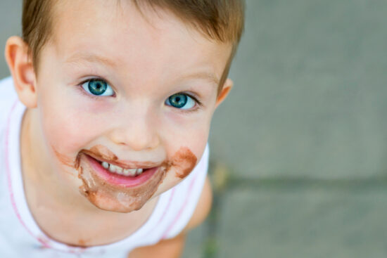Boy smeared ice cream.