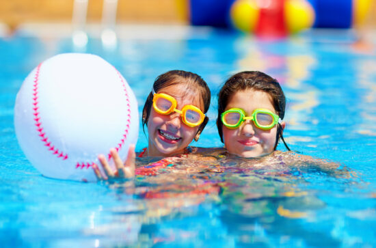 teenage girls with braces in a swimming pool